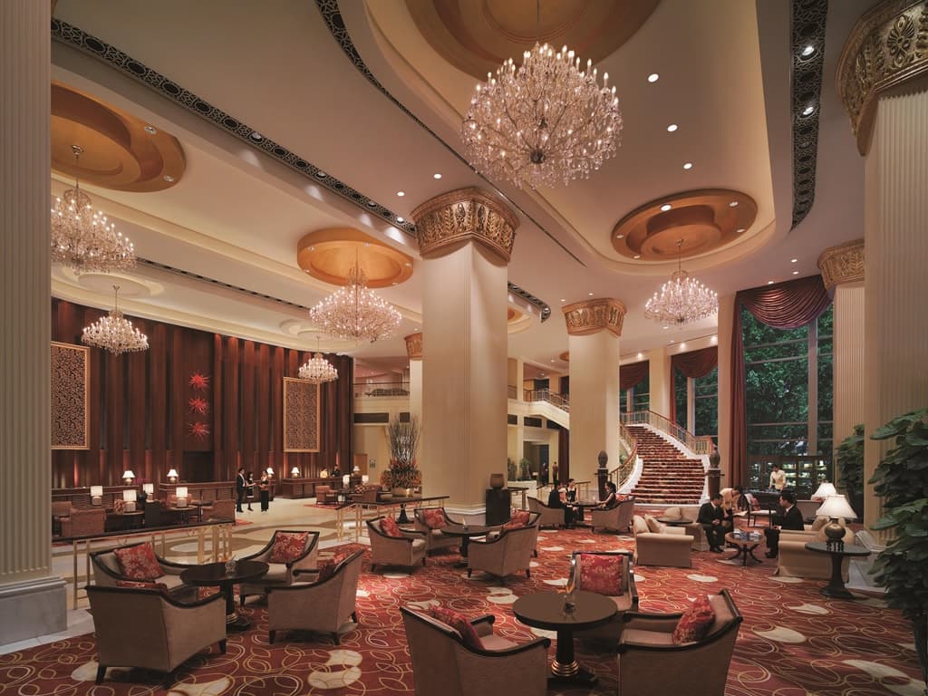 The soaring atrium of Shangri-La Fuzhou featuring 232 suspended jasmine-shaped lanterns illuminating the lobby.