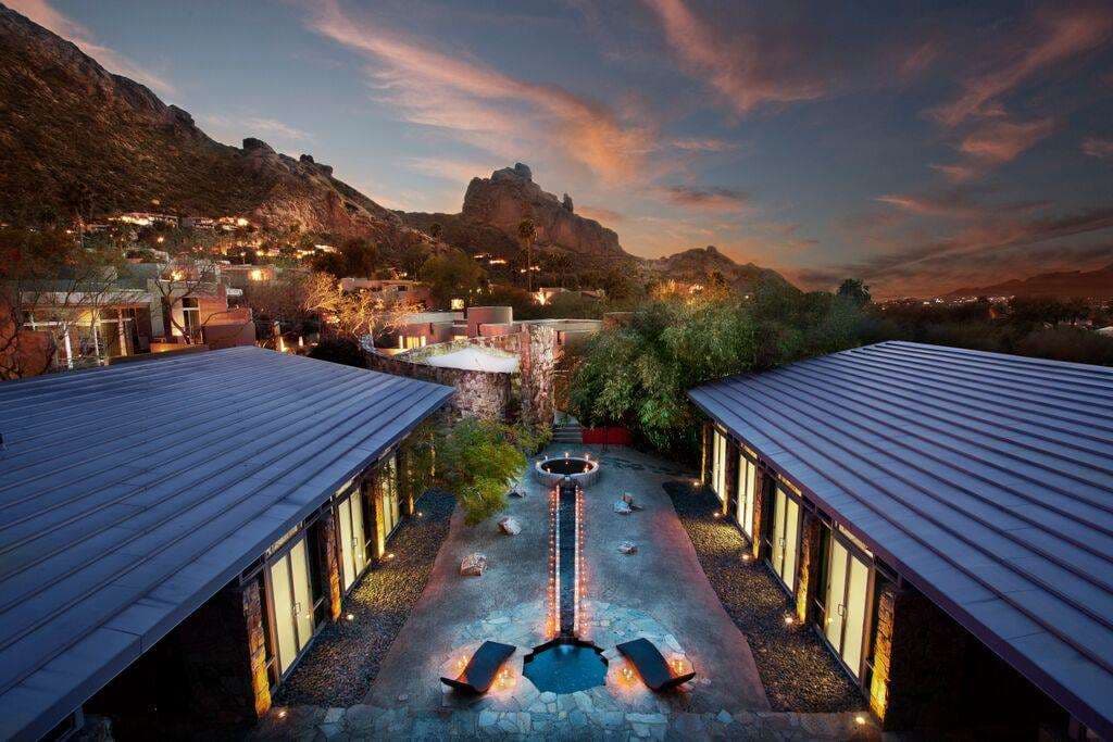 Sanctuary Camelback Mountain infinity pool at sunset reflecting Mummy Mountain and the new architectural brise soleil.