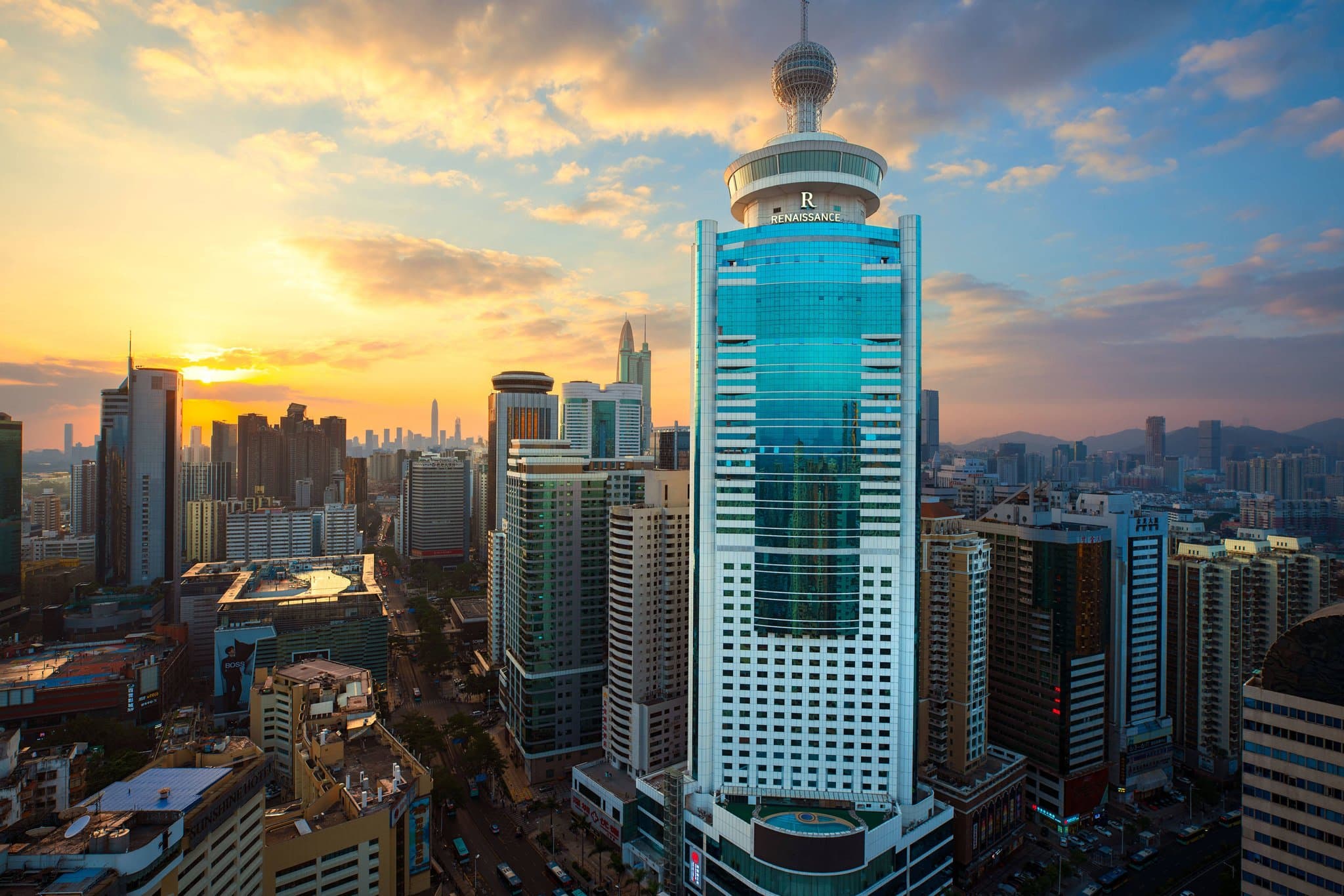 Diners enjoying the city view from the curved windows of the Sky Paradise revolving restaurant on the 50th floor.