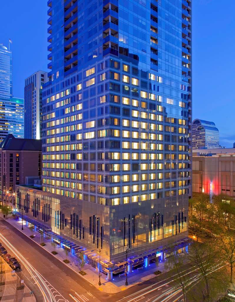 The distinct blue glass architectural fin of Hyatt at Olive 8 rising above the Seattle skyline.