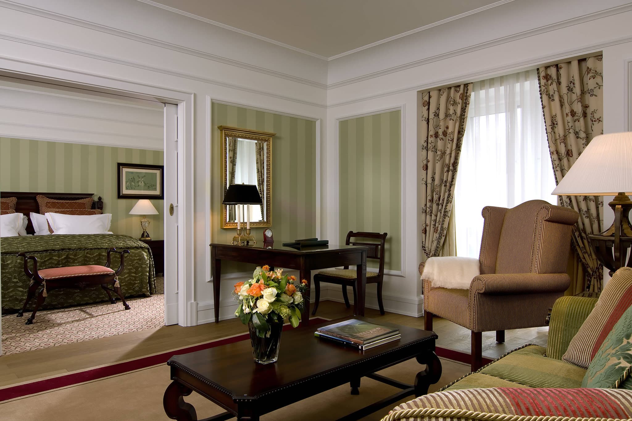 The Palladian crescent facade of Powerscourt Hotel Resort & Spa with the Great Sugar Loaf Mountain in the background.