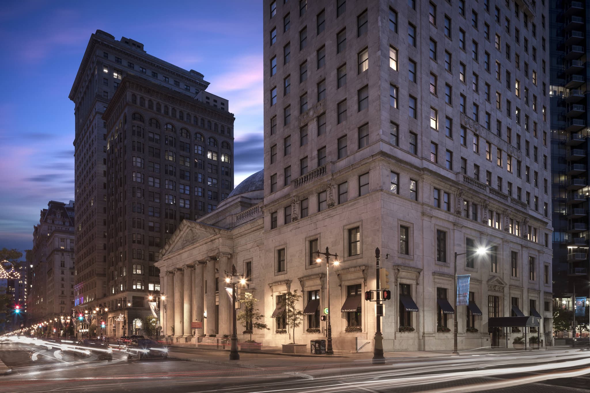 Low-angle view of the Ritz-Carlton Philadelphia's massive marble rotunda dome with Aqimero restaurant seating below.
