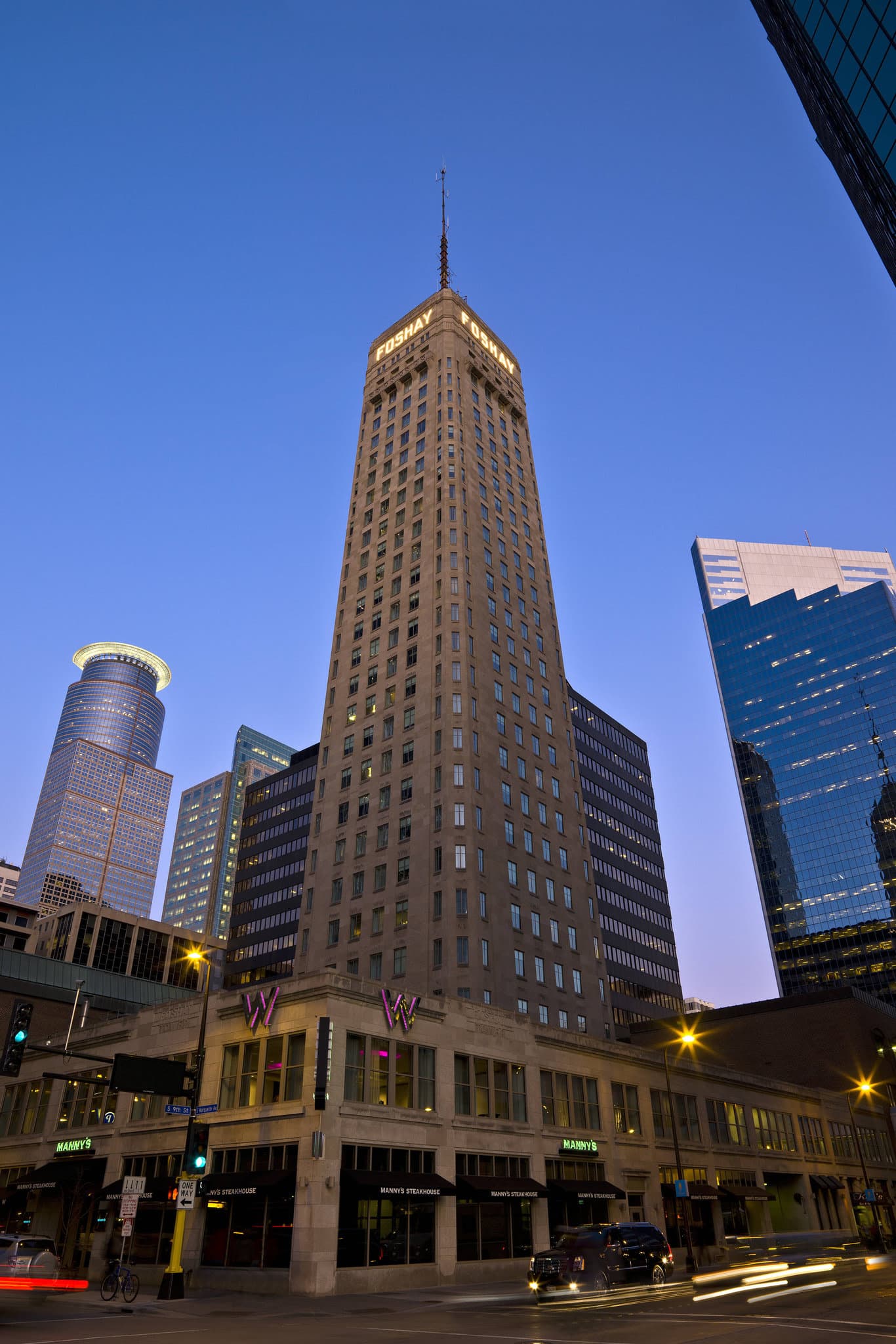 The illuminated Art Deco spire of W Minneapolis - The Foshay tower standing out against the night skyline.
