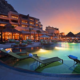 The torch-lit entrance of the Dos Mares tunnel leading to the Waldorf Astoria Los Cabos Pedregal.