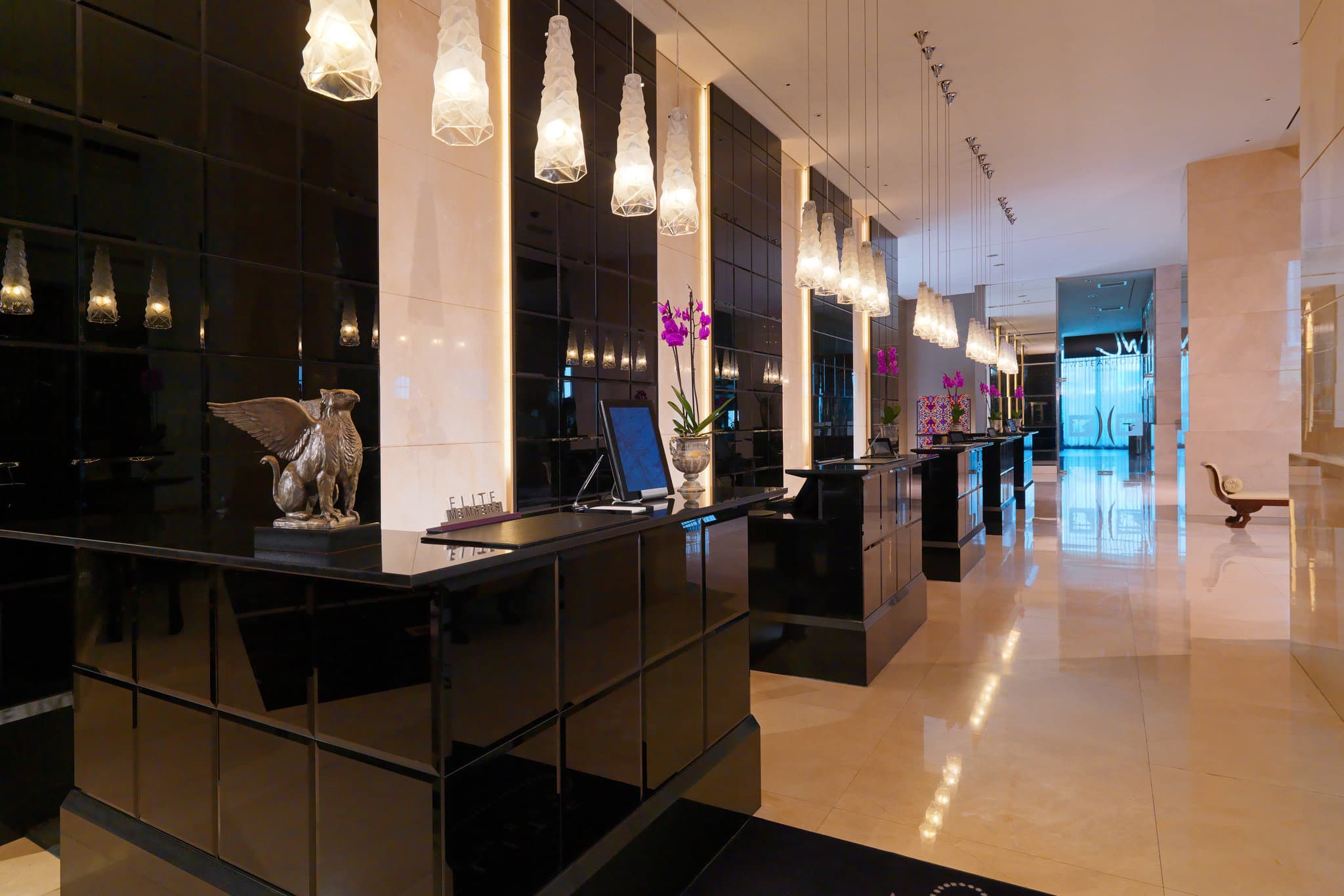 JW Marriott Ankara lobby atrium featuring 15-meter crystal chandeliers and polished marble floors.