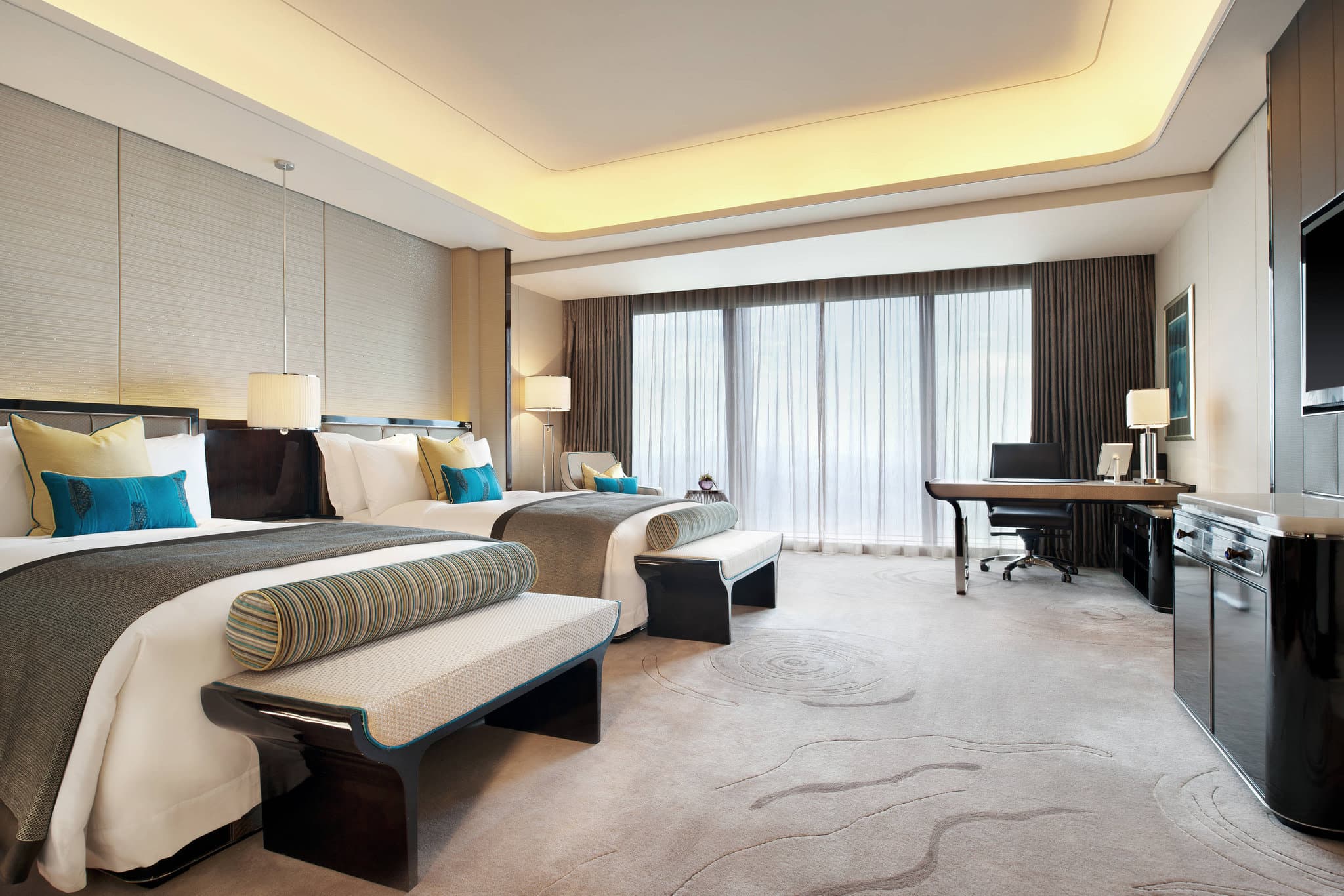The dizzying 96th-floor atrium of the St. Regis Shenzhen, featuring a massive crystal chandelier and floor-to-ceiling windows overlooking the skyline.