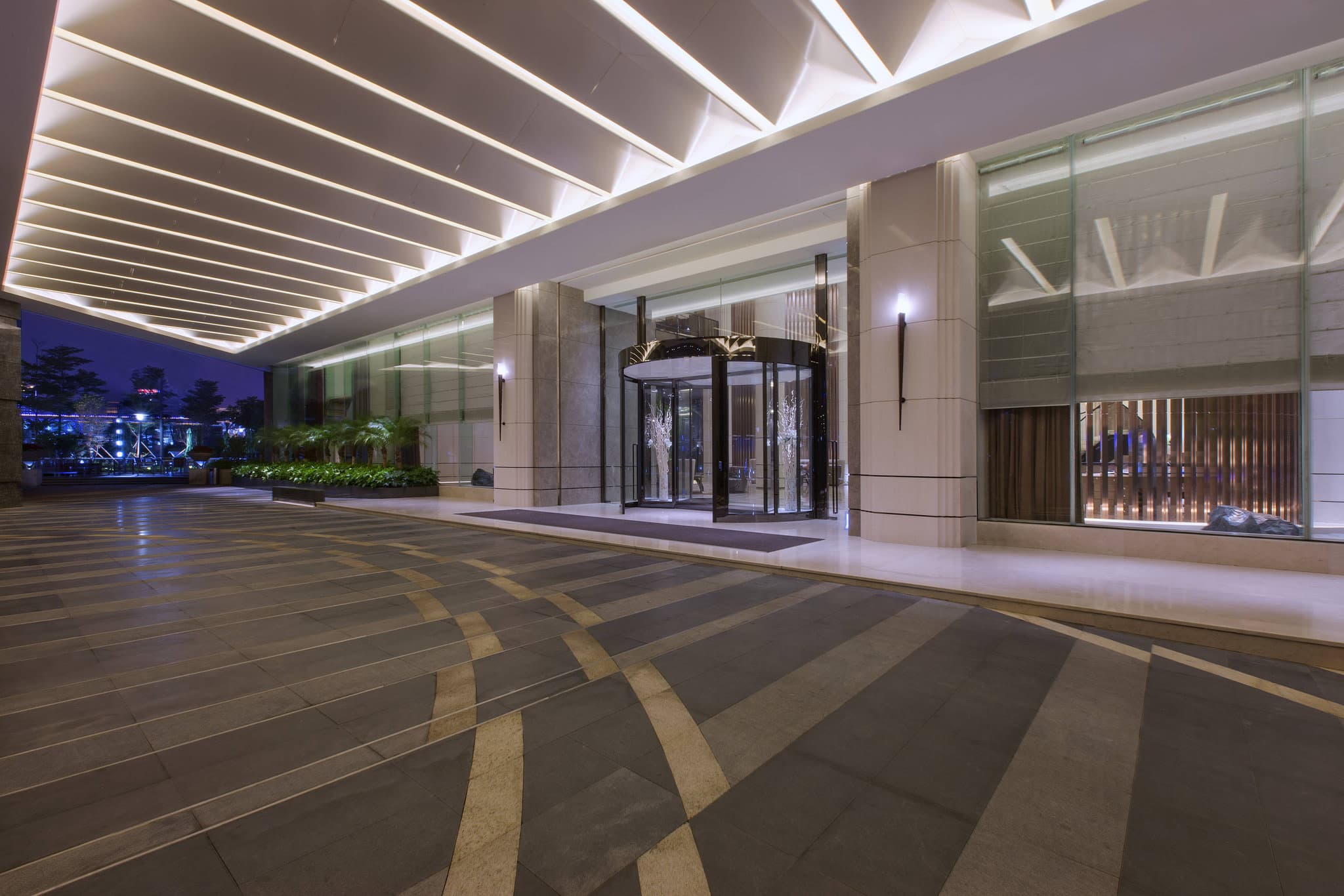 The Westin Xiamen's illuminated sail-shaped exterior towering over the Xiamen Central Business District night skyline.