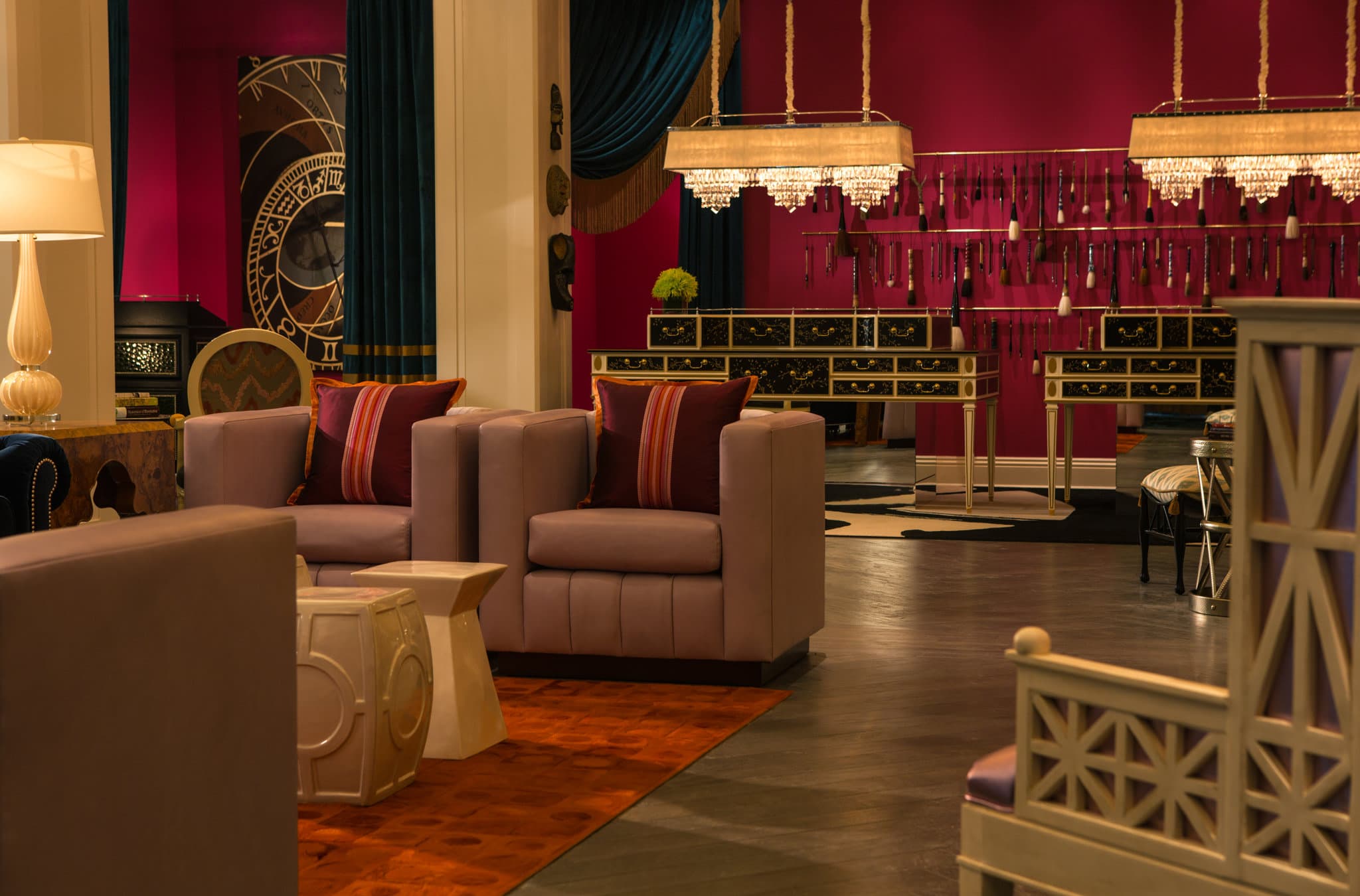 A vibrant rooftop lounge at dusk with green walls, fire pits, and guests enjoying cocktails, overlooking the Philadelphia historic district.