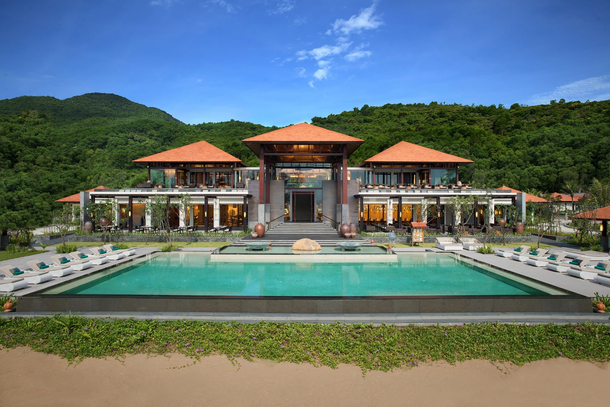 Infinity pool of a Hillside Pool Villa at Banyan Tree Lang Co overlooking the East Sea and jungle canopy.