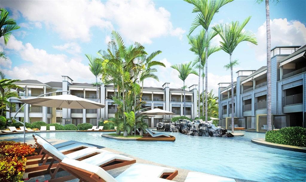Circular daybeds on the terrace of a swim-up suite at Azul Beach Resort Negril, overlooking a turquoise lazy river.