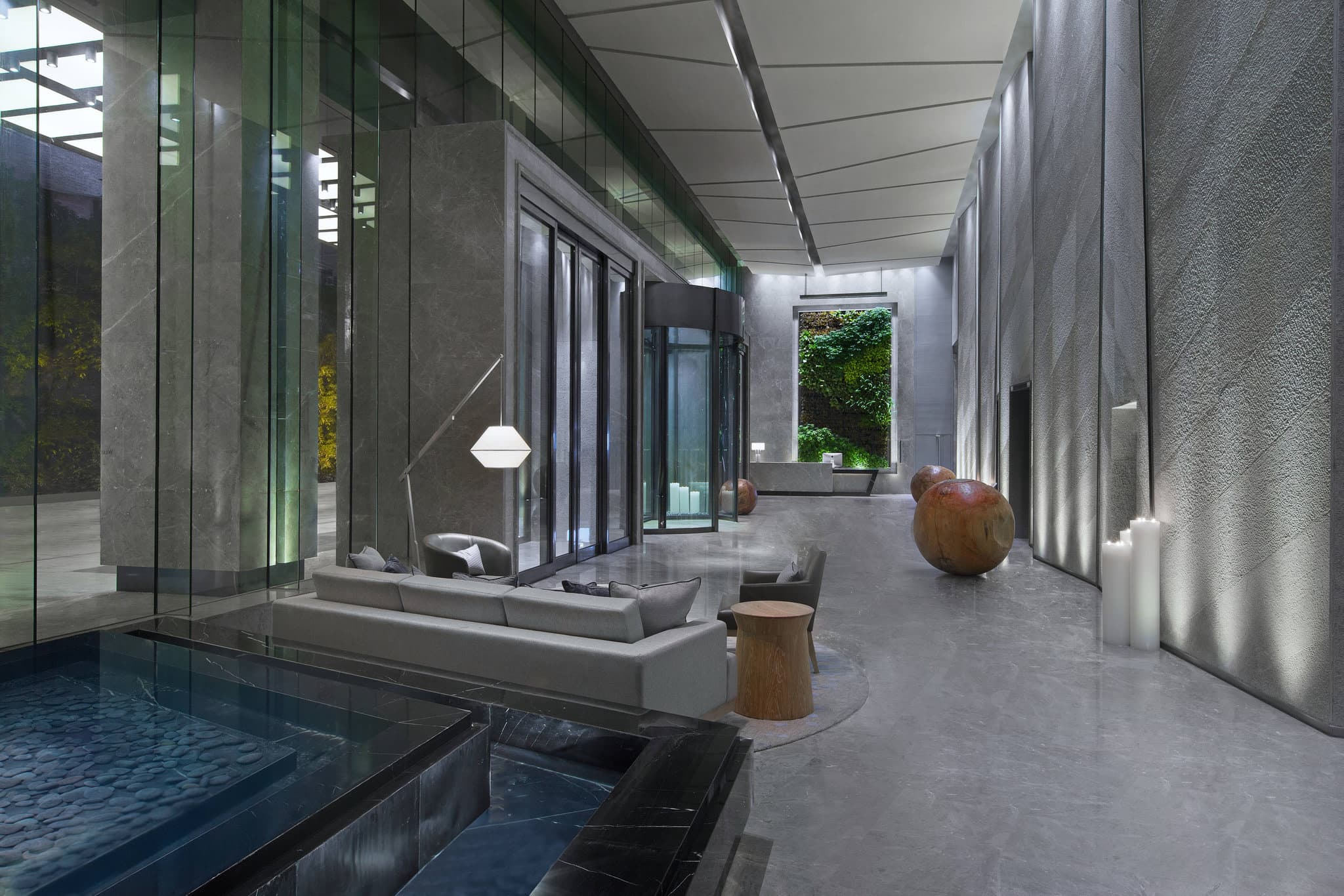 A dramatic view of the glass-bottom infinity pool on the 54th floor of The Westin Chongqing, cantilevered over the Jiefangbei skyline at dusk.