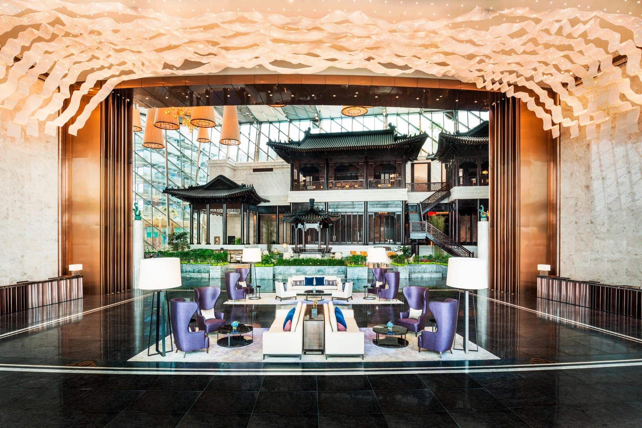 Modern exterior and luxurious guest rooms of the 5-star Sheraton Zhuhai Hotel near Macau.