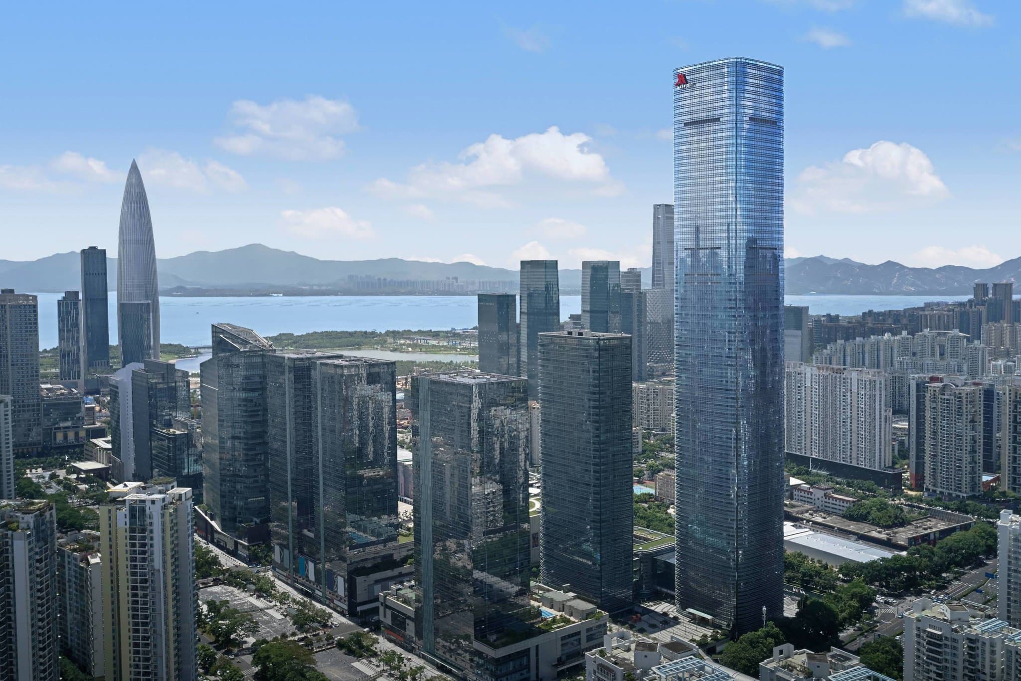 View from the 62nd-floor infinity pool at Shenzhen Marriott Nanshan features glowing bubble lamps and panoramic skyline views.