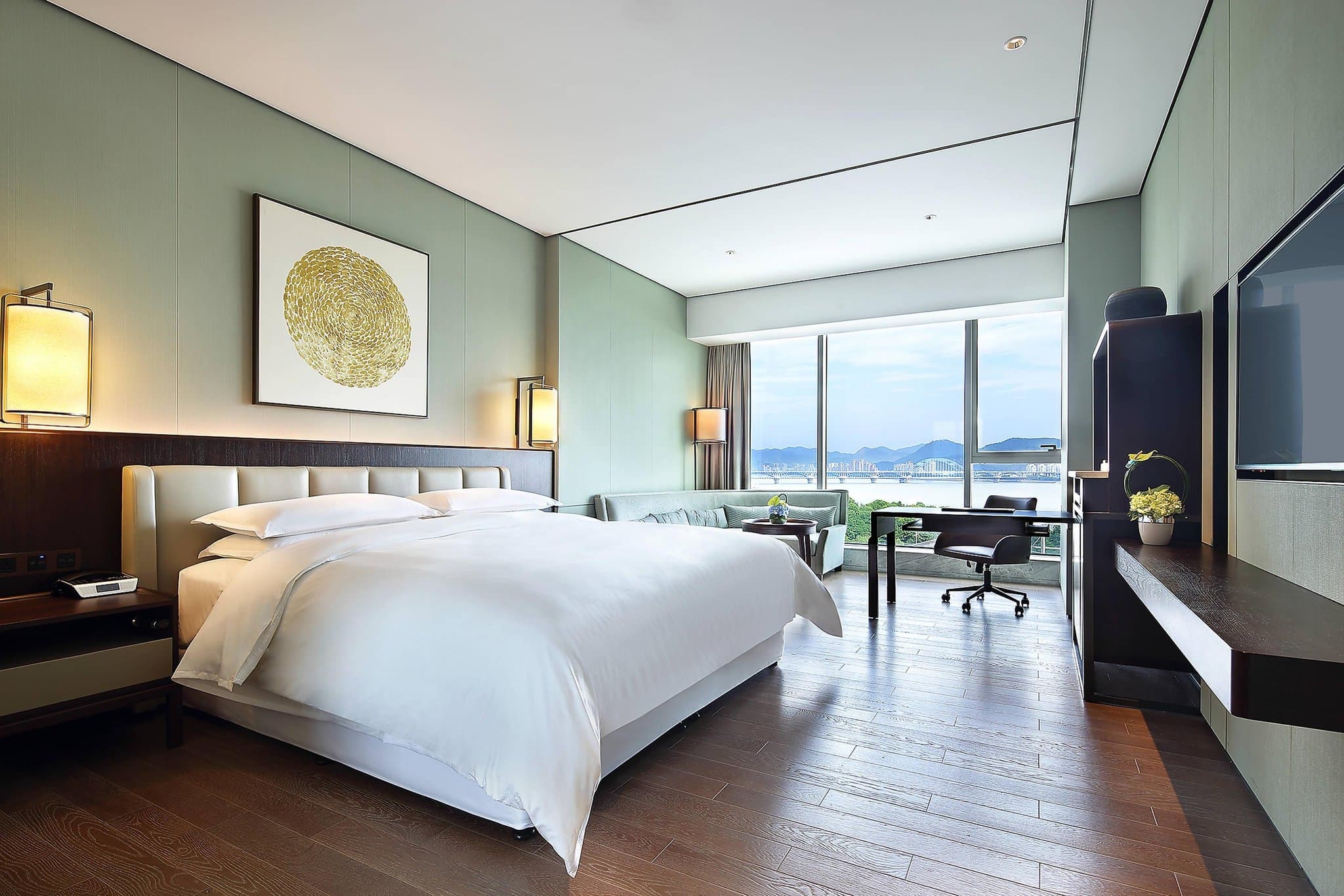 A panoramic view of the Qianjiang New City skyline illuminated at night, seen from a high-floor suite at the Sheraton Grand Hangzhou Binjiang.