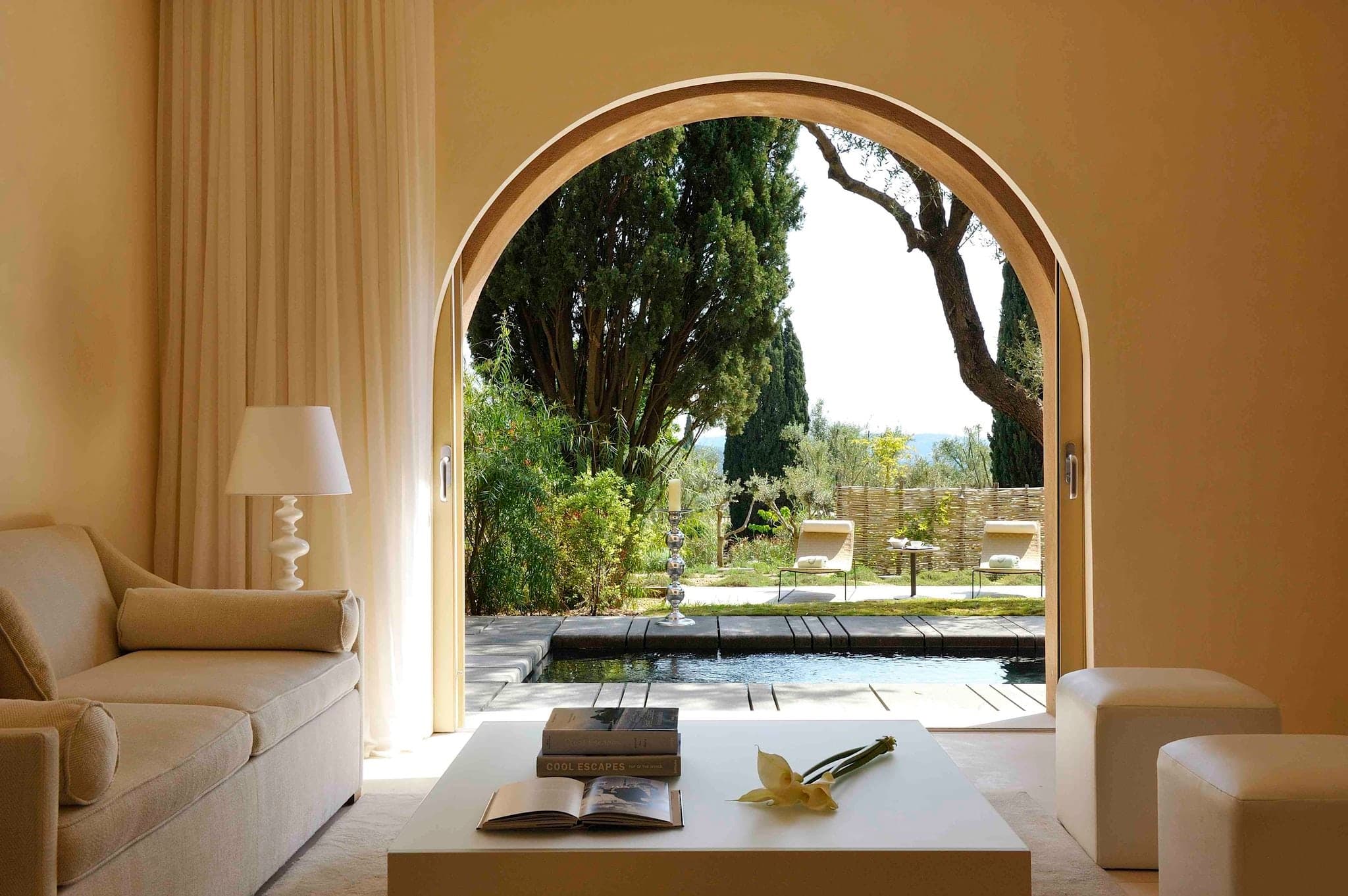 MUSE Saint-Tropez main 'Water Salon' pool surrounded by white cabanas and tiered Mediterranean gardens.