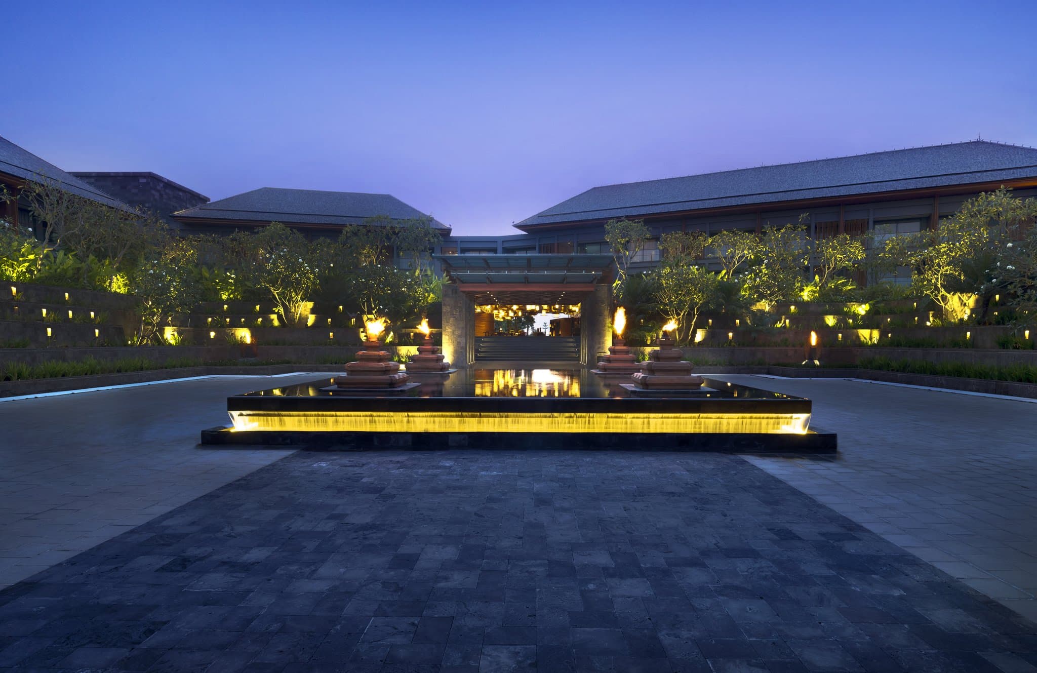 The adults-only Secret Garden Pool at Hotel Indigo Bali surrounded by lush tropical greenery and stone walls.