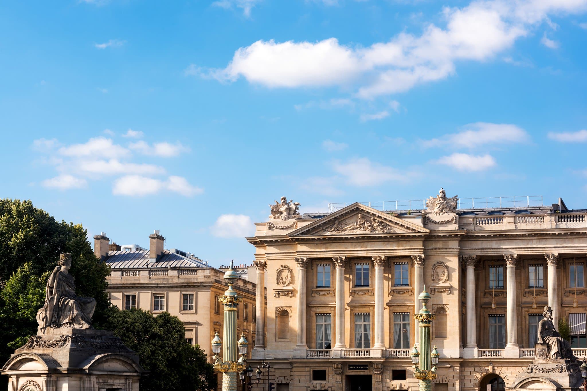 The subterranean pool at Hôtel de Crillon, glowing with 17,600 gold scales and illuminated by a natural skylight.