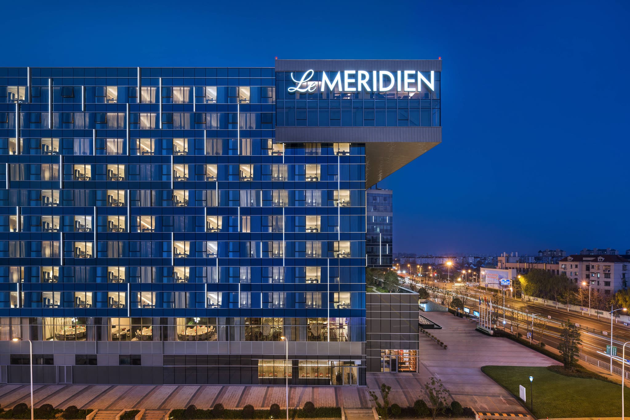 Exterior view of Le Meridien Shanghai Minhang with modern facade and upscale entrance in Shanghai