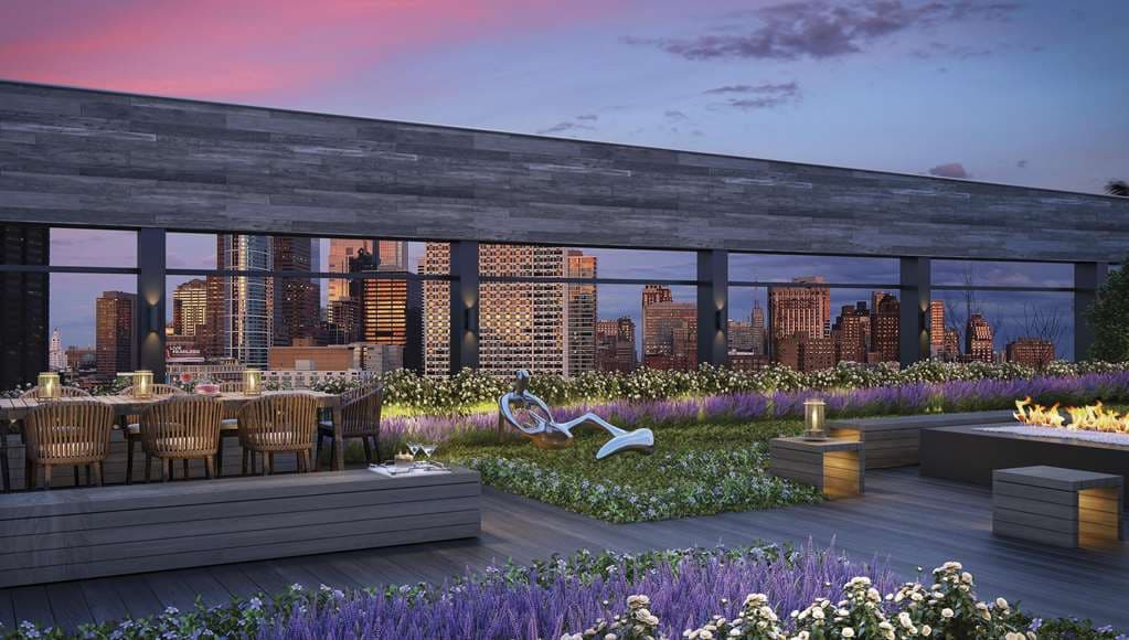 Infinity-edge pool on Level 28 at AKA University City overlooking the Philadelphia skyline at twilight.