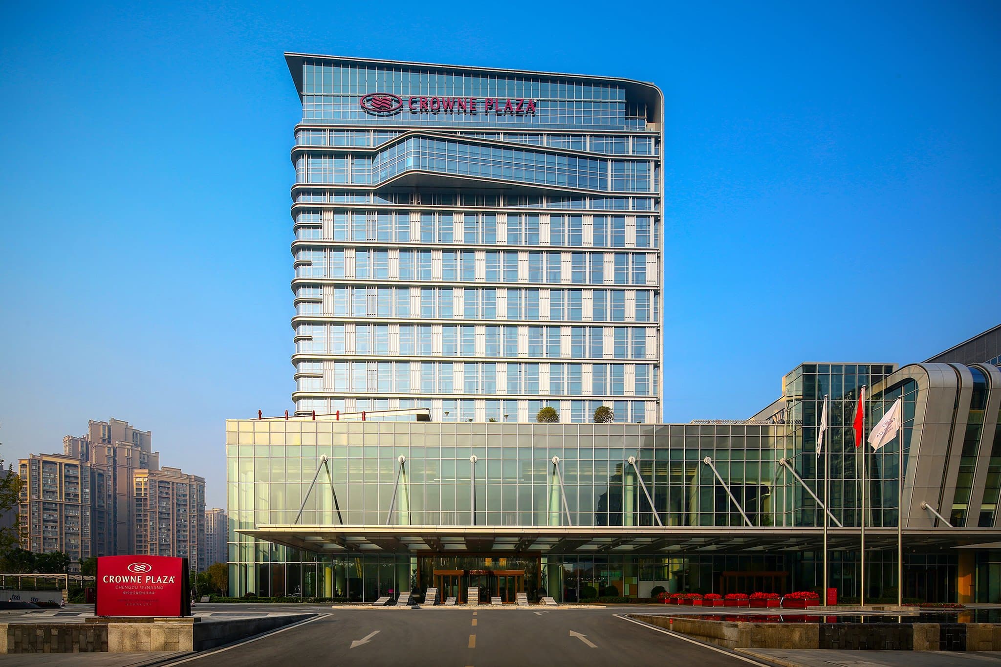 Exterior of Crowne Plaza Wenjiang, a 5-star hotel near Chengdu East Railway Station.