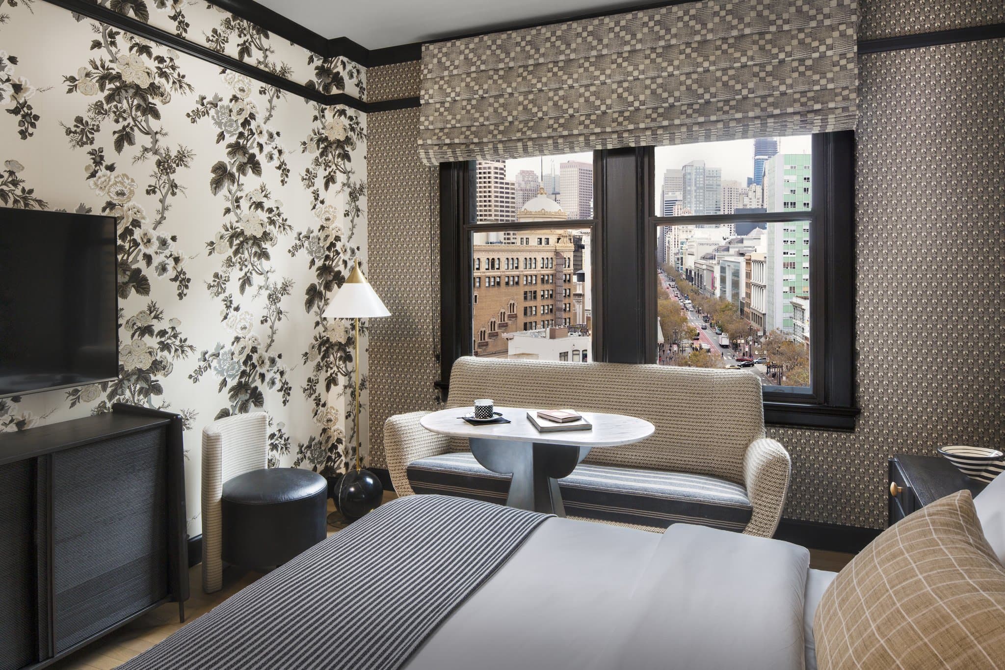 Kelly Wearstler designed lobby at San Francisco Proper with gallery walls and mixed vintage furniture.