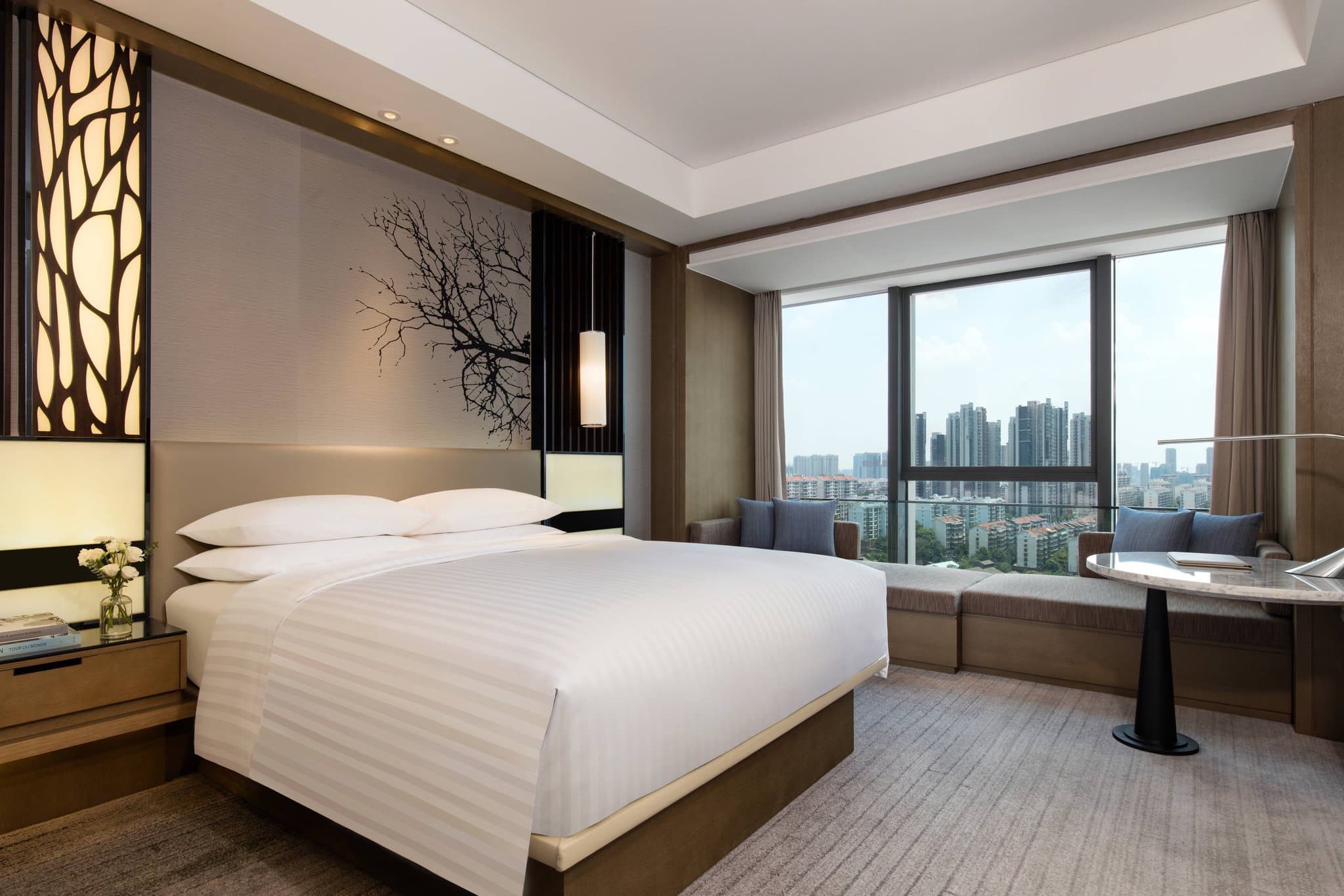 Exterior and guest room view of Courtyard Changsha Marriott, a modern 4-star hotel in Changsha