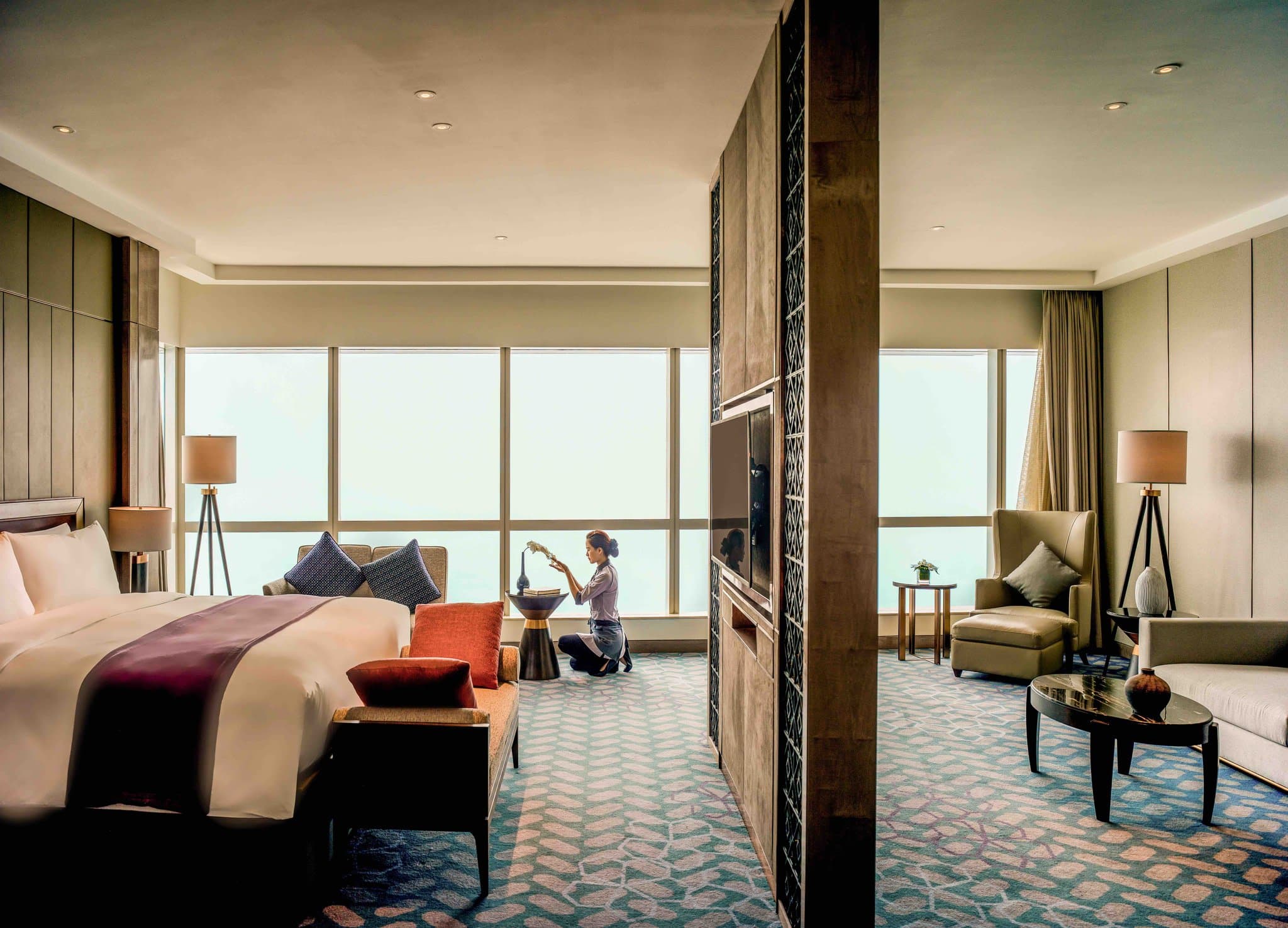 The Hive Lounge at InterContinental Hanoi Landmark72 featuring dramatic honeycomb ceiling architecture and floor-to-ceiling windows overlooking the Hanoi skyline.