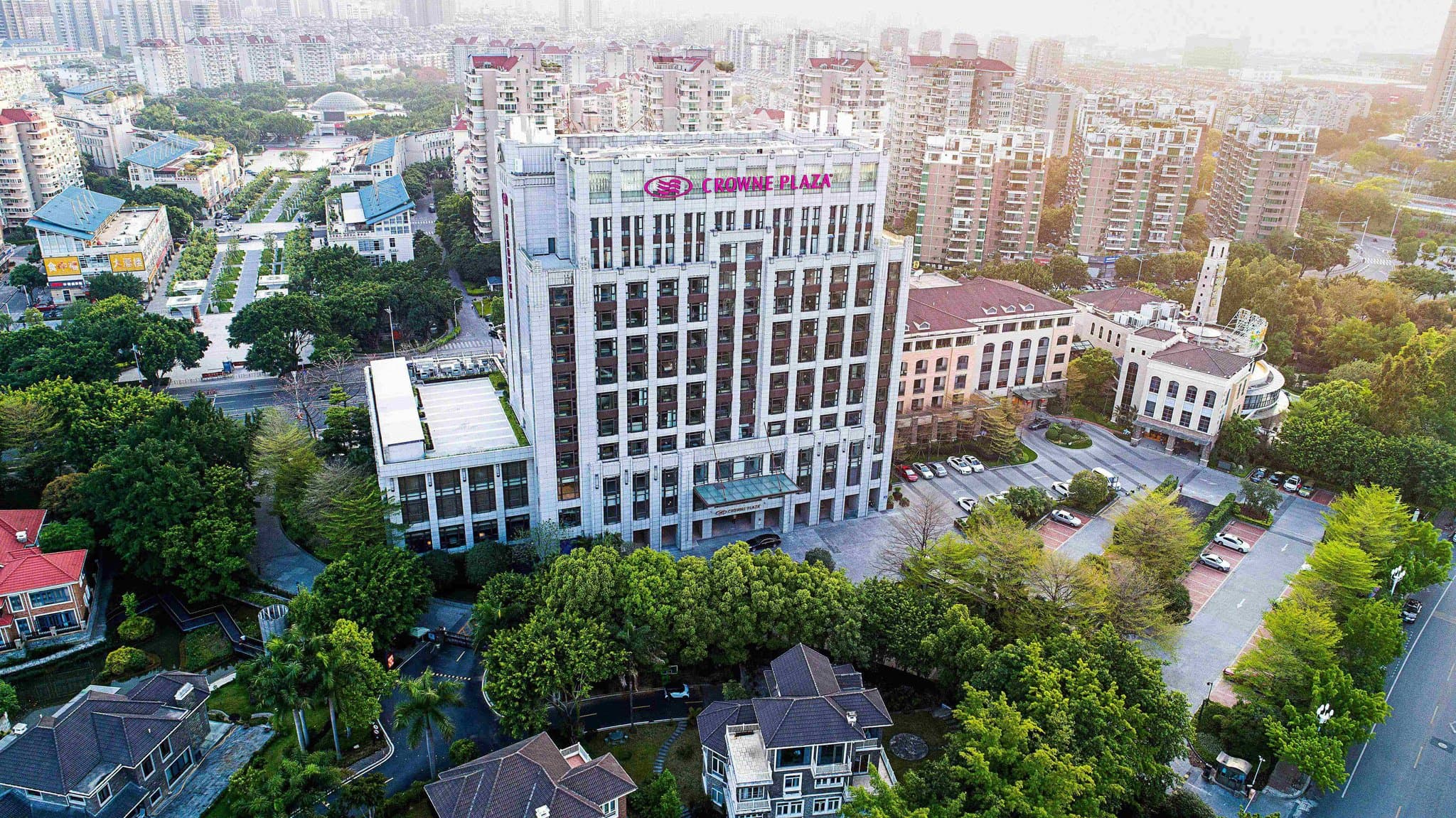 Night view of Fuzhou skyline seen through the floor-to-ceiling windows of a Crowne Plaza Fuzhou South guest room.