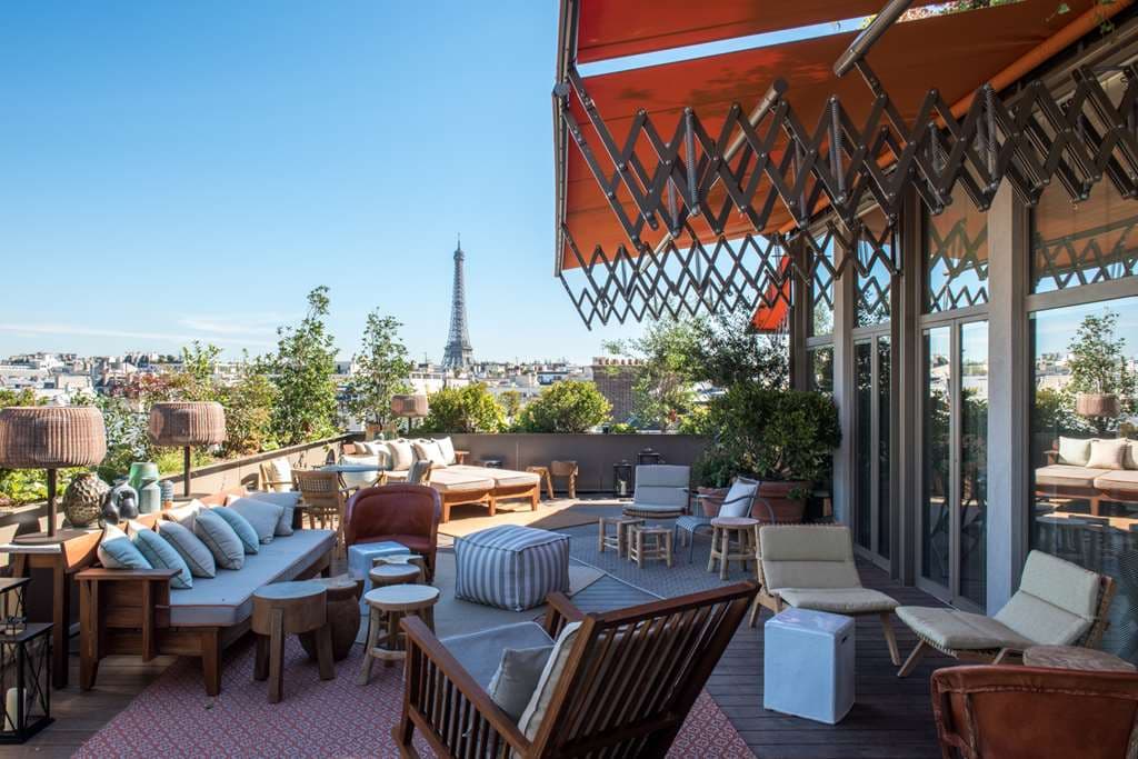 Rooftop view from Brach Paris showing the vegetable garden in the foreground and the Eiffel Tower in the background.