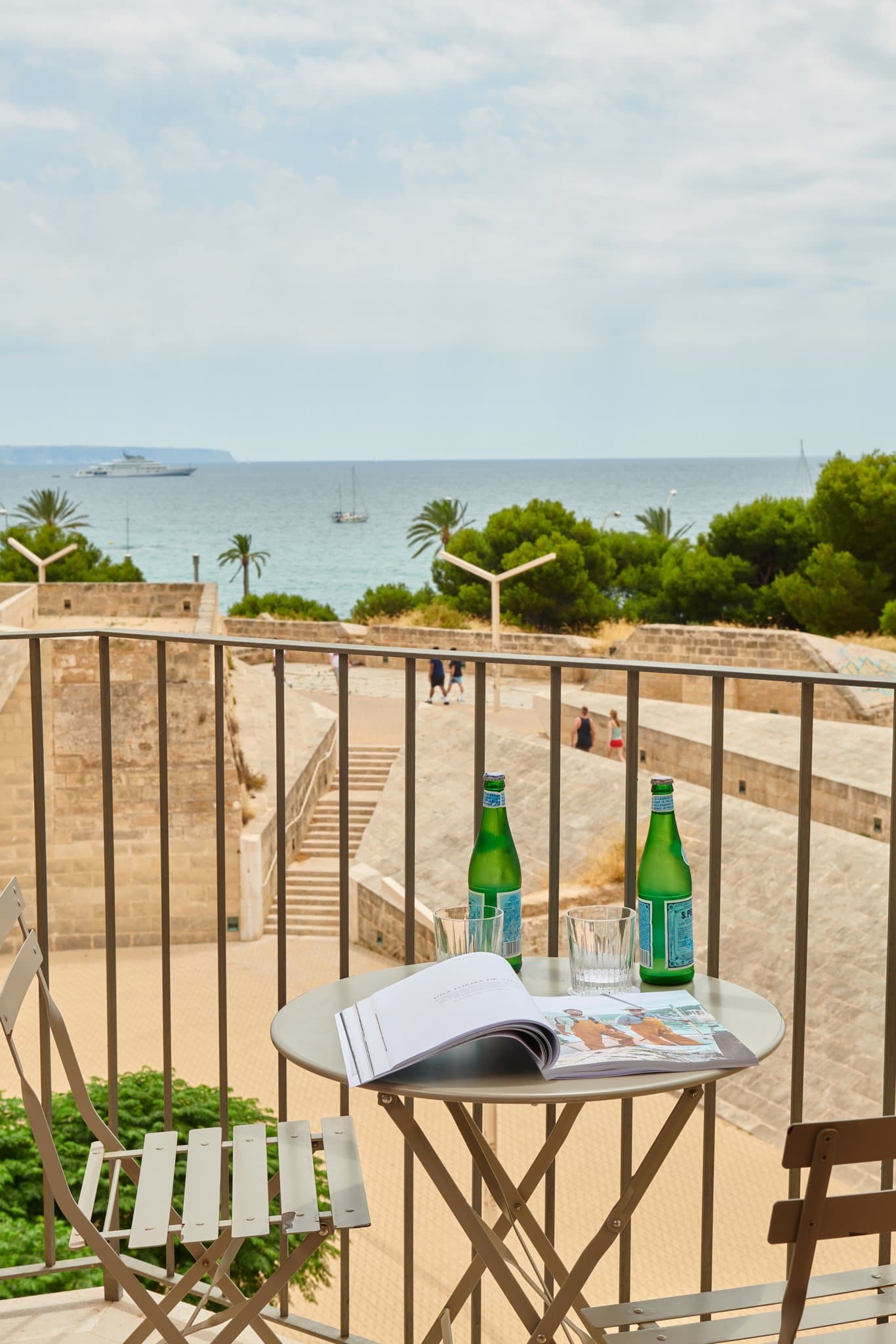 Es Princep rooftop infinity pool, Almaq, merging visually with the Mediterranean Sea against the historic Baluard city walls.