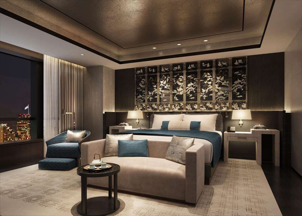 Fairmont Wuhan indoor swimming pool with floor-to-ceiling windows overlooking the Hankou business district skyline.