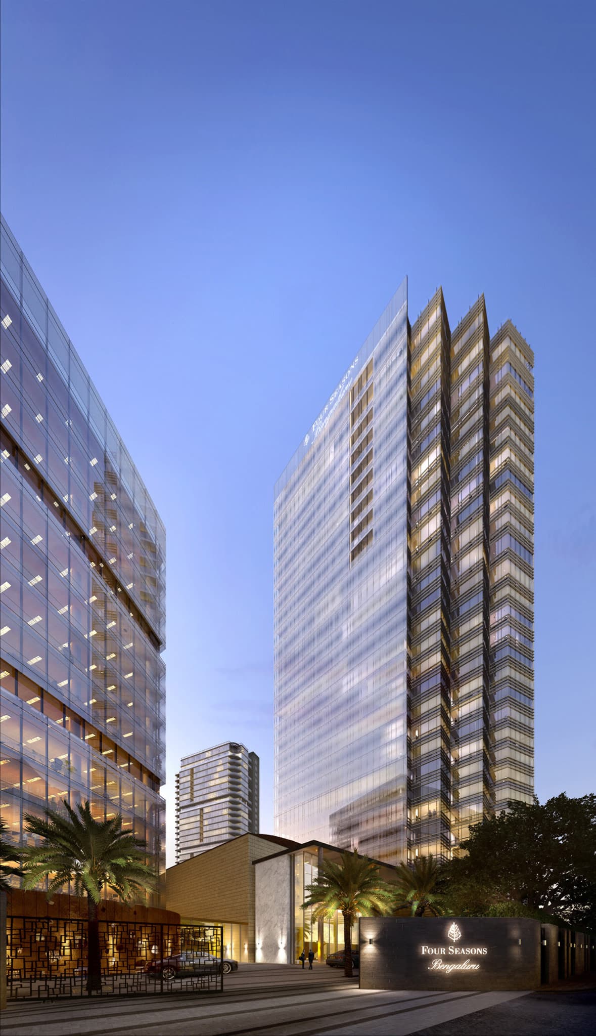 Sunset view from Copitas terrace at Four Seasons Bengaluru featuring sleek modern furniture and the city skyline.