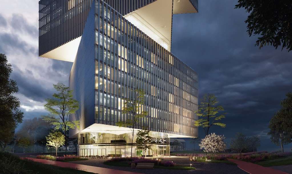 Exterior view of nhow Amsterdam RAI showing three stacked triangular glass volumes against a blue sky.