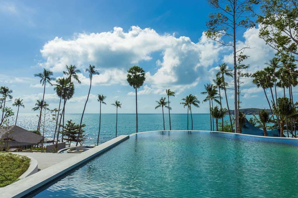 The geometric cubes of The Reservoir pool at Hyatt Regency Koh Samui surrounded by Yang Na trees.