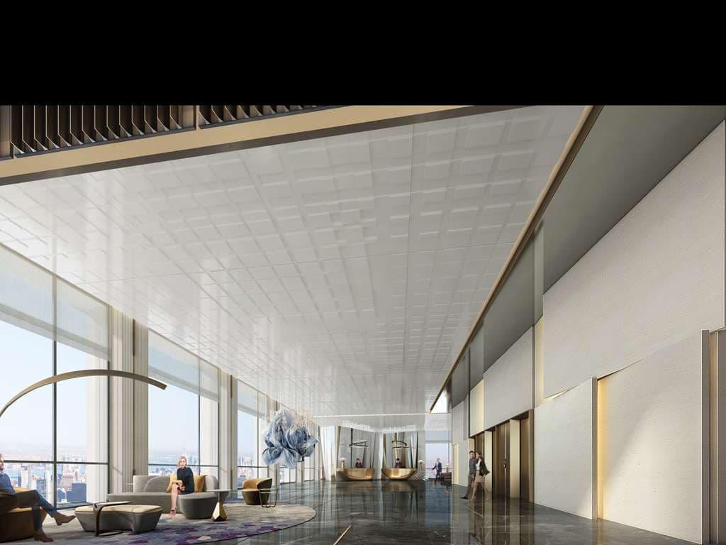 A dramatic spiral staircase in the Sofitel Haikou lobby with high ceilings and modern lighting.