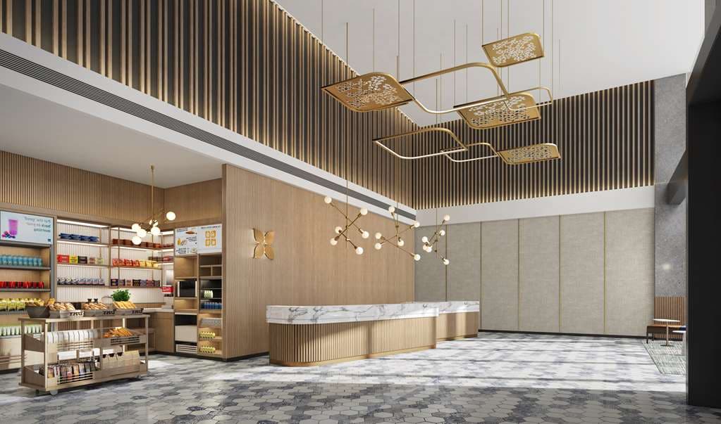A modern hotel lobby featuring a dramatic, large-scale flower-shaped chandelier and an artistic 'City Mark' mural on the back wall.